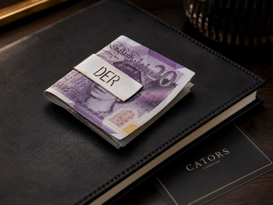 Cators sterling silver money clip shown as a refined alternative to a traditional wallet.